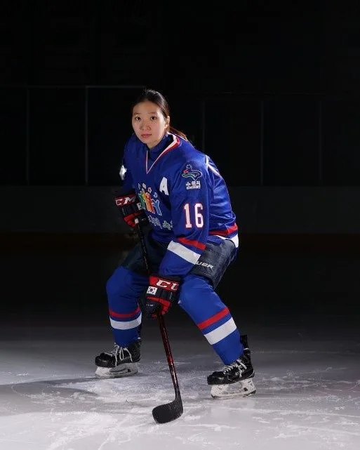 Susie Jo in her number 16 playing jersey on the ice
