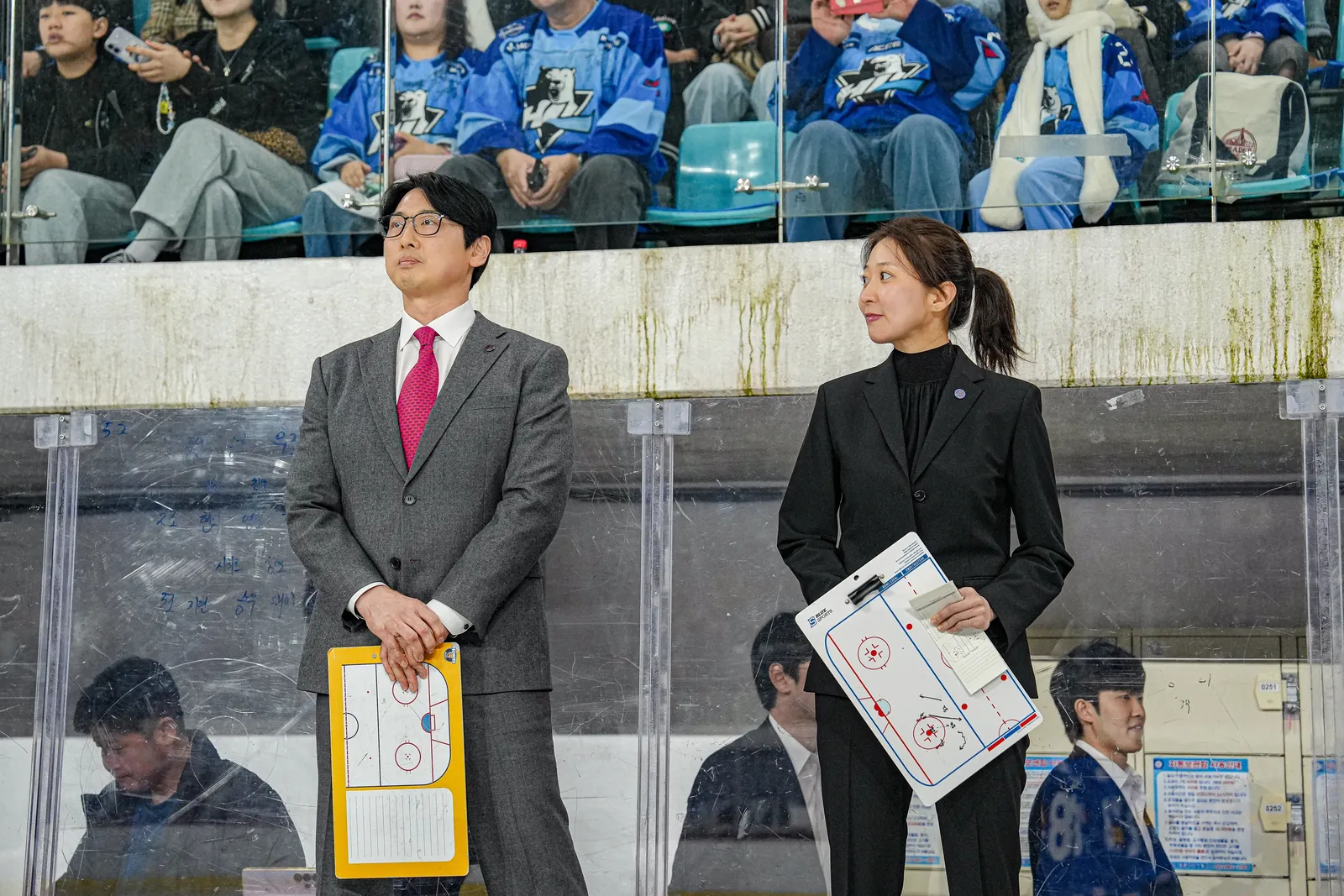Susie Jo behind the bench during a game