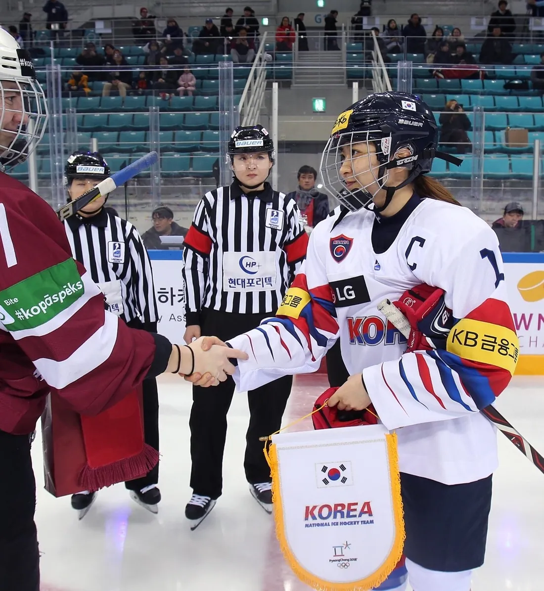 Susie Jo shaking hands as captain before a game