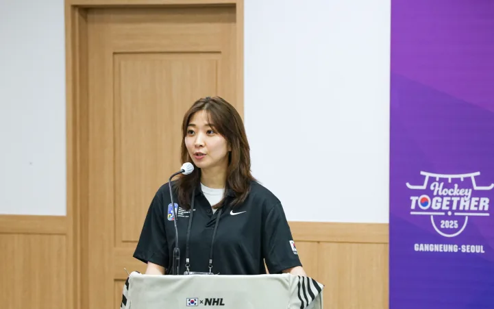 Susie Jo presenting at a Hockey Together event