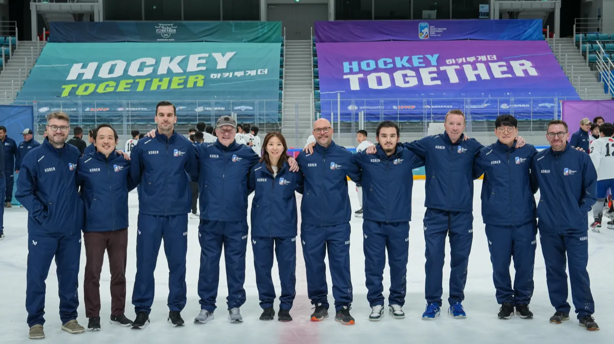 International coaching staff on the ice at Hockey Together