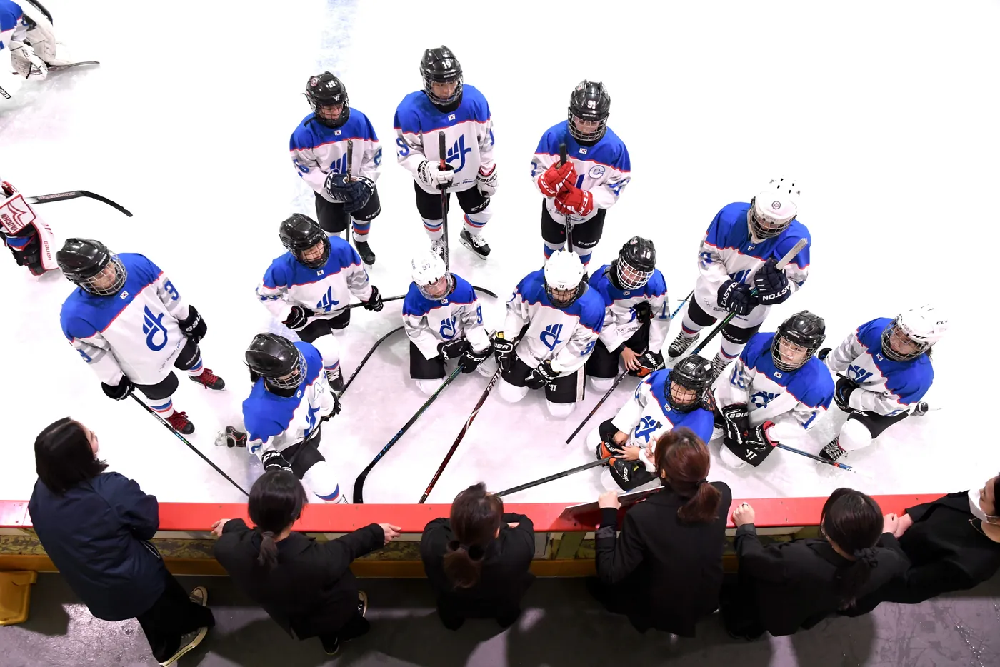 Team huddle seen from above