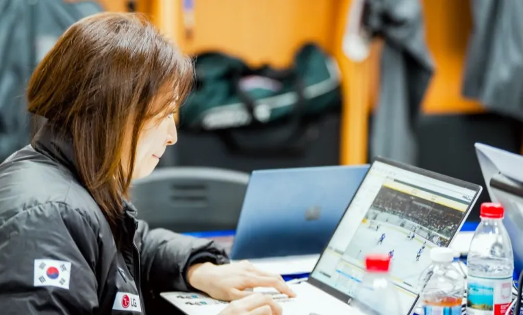 Susie Jo analysing game video on a laptop